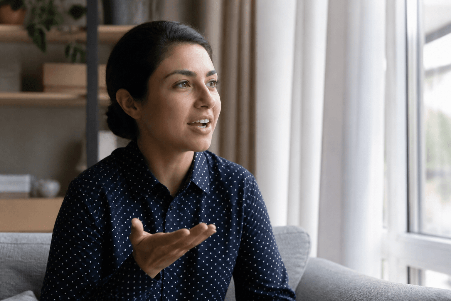 A relaxed person practicing a conversation at home
